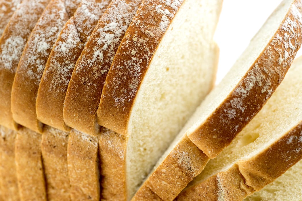 Closeup macro of loaf of bread with slices.

Bread loaf sliced generic