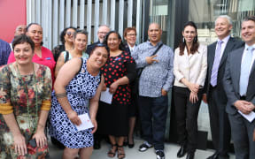 Prime Minister Jacinda Ardern and stakeholders outside the Royal Oak Housing Community.