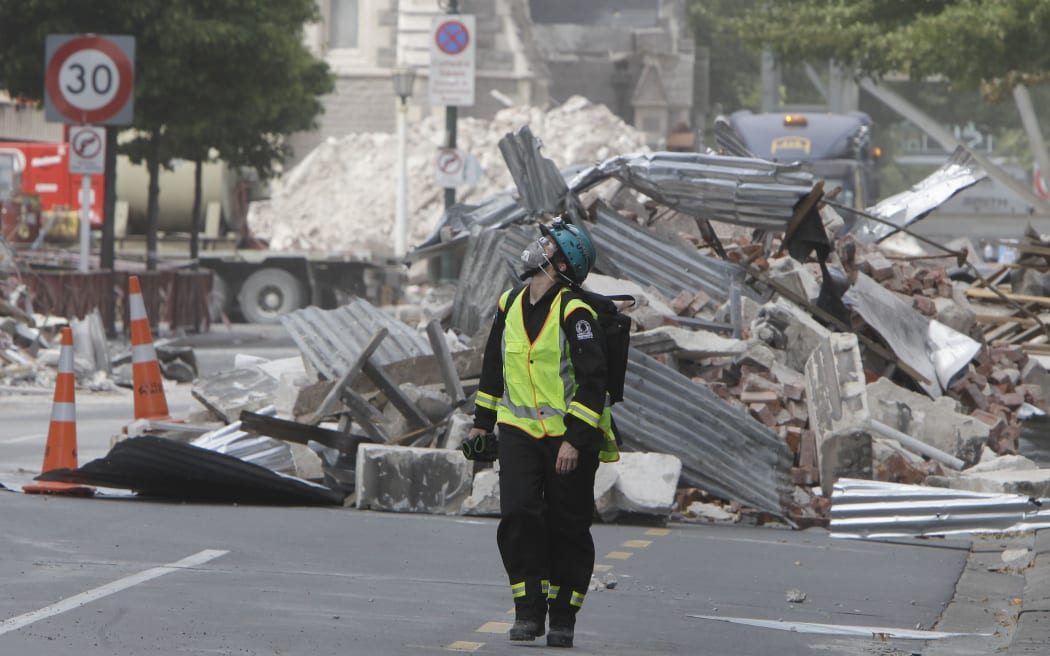 A New Zealand Urban Search and Rescue worker walks through the central business district after the February 2011 quake.