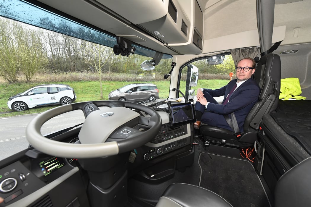 Flemish Minister Ben Weyts poses with a truck at a press meeting on the 'EU Truck Platooning Challenge 2016' involving self-driving trucks which are traveling from Sweden to Rotterdam via Belgium.
