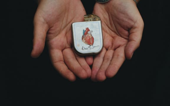 Rose holds her first ICD, which features a painted heart by Yuri Zupancic.