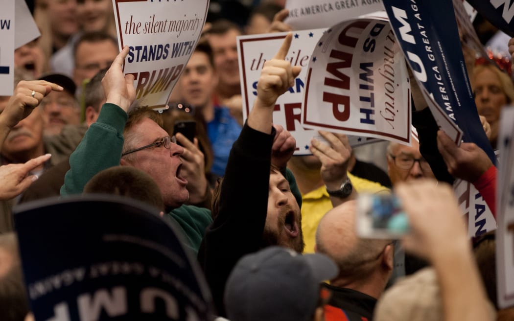 A protester interrupts as Republican presidential candidate Donald Trump speaks at a campaign event at the I-X Center in Cleveland, Ohio.