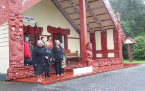 Waitara kuia call the official party onto Owae Marae