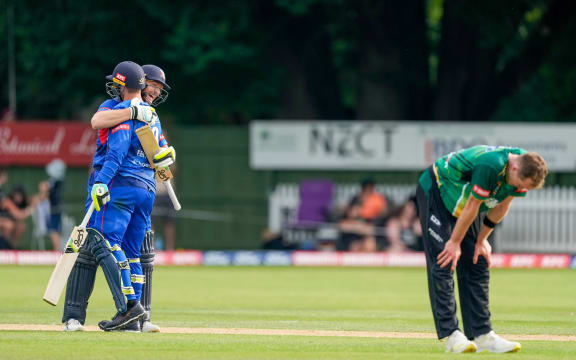 Auckland Aces Martin Guptill and Lockie Ferguson celebrate the win over Central Stags 2021.