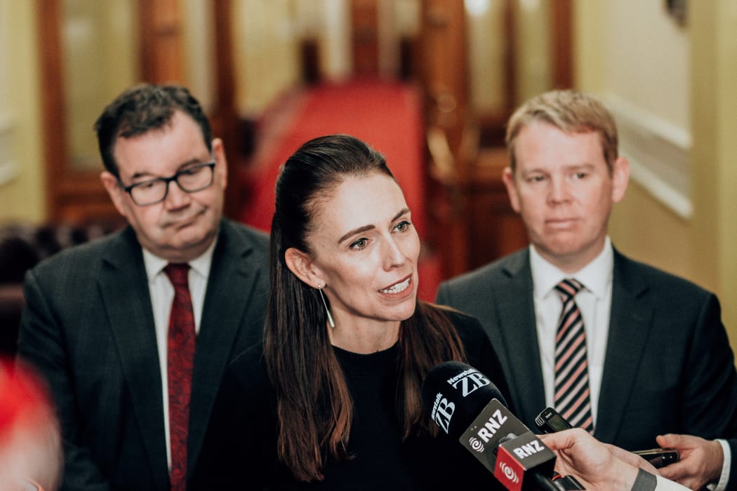 Jacinda Ardern flanked by Grant Robertson, left, and Chris Hipkins, right.