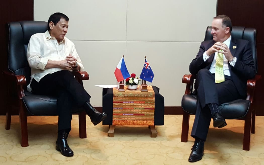 NZ Prime Minister John Key (right) meets with Philippine president Rodrigo Duterte at the East Asia Summit.