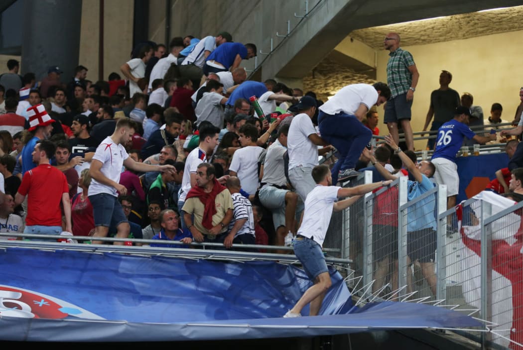 English football fans leave the stadium after the UEFA Euro 2016 group stage match between the English and Russian national teams.