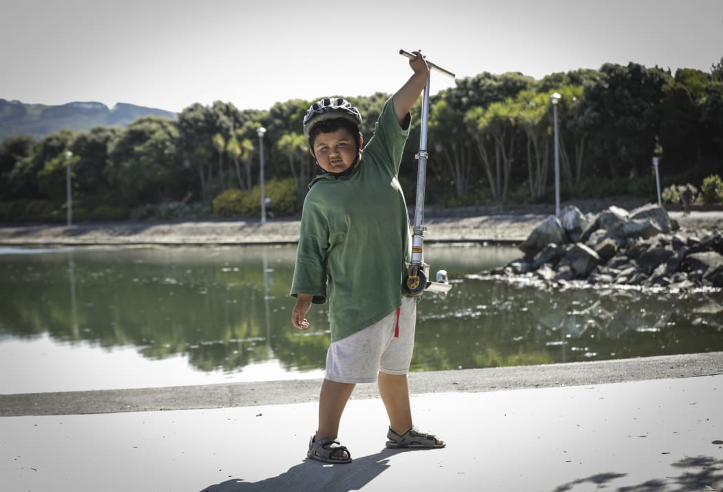 Dre Piki-Lyttle (7) lifts his scooter of the ground at one of The Green Prescription Active Family days in Porirua. The Programme is run by Sport Wellington nationwide.