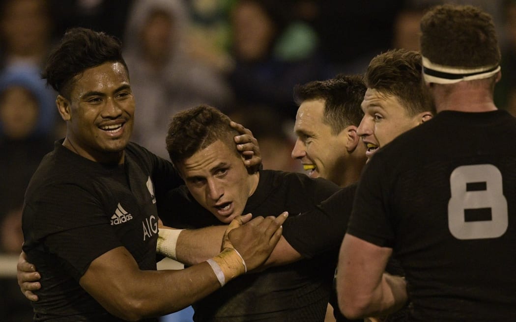 TJ Perenara is congratulated for scoring New Zealand's third try