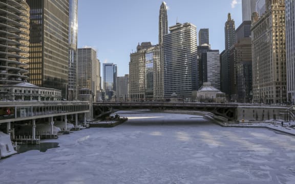 Ice covers the Chicago River today in Chicago.