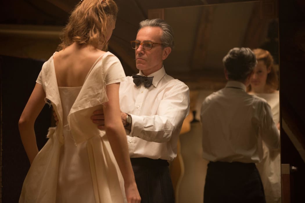 Daniel Day-Lewis as Reynolds Woodcock fits Alma (Vicky Krieps) in PT Anderson’s Phantom Thread.