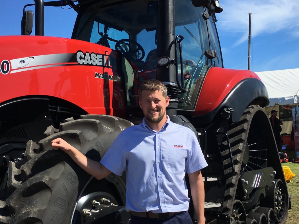 Case IH operations manager Tim Fanning infront of a Magnum Rowtrac.