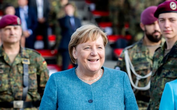 German Chancellor Angela Merkel attends a recruits pledge during a military roll call of the military evacuation operation (MilEvakOp), in Seedorf, northern Germany on September 22, 2021.