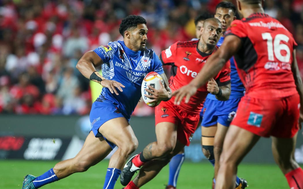 Samoa's Fa'amanu Brown looks to breach the Tongan defence.