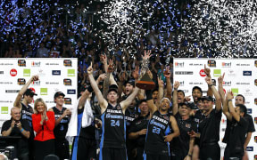 Breakers' CJ Bruton and Dillon Boucher lift the trophy with the team in 2012.