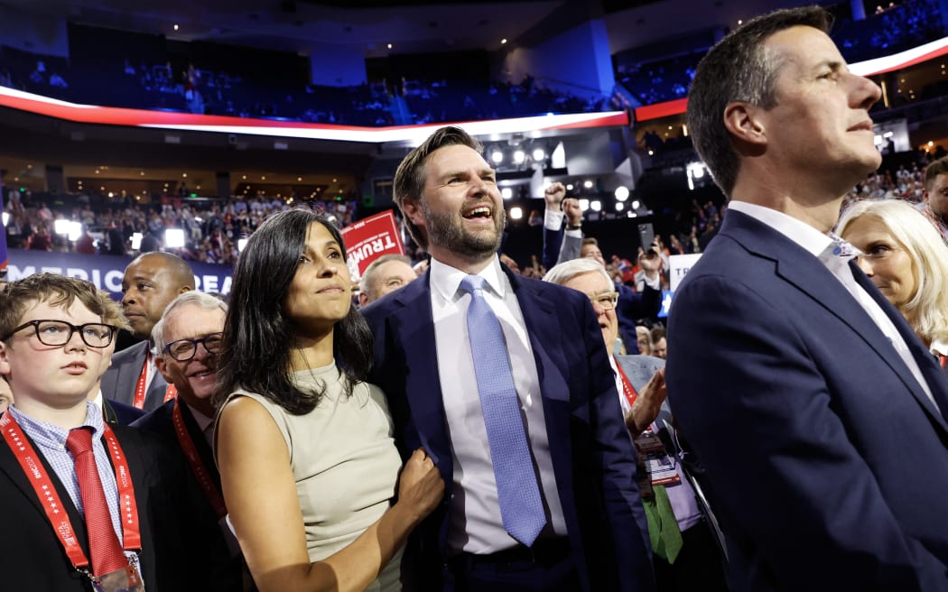 MILWAUKEE, WISCONSIN - JULY 15: U.S. Sen. J.D. Vance (R-OH) and his wife Usha Chilukuri Vance look on as he is nominated for the office of Vice President on the first day of the Republican National Convention at the Fiserv Forum on July 15, 2024 in Milwaukee, Wisconsin. Delegates, politicians, and the Republican faithful are in Milwaukee for the annual convention, concluding with former President Donald Trump accepting his party's presidential nomination. The RNC takes place from July 15-18.   Anna Moneymaker/Getty Images/AFP (Photo by Anna Moneymaker / GETTY IMAGES NORTH AMERICA / Getty Images via AFP)