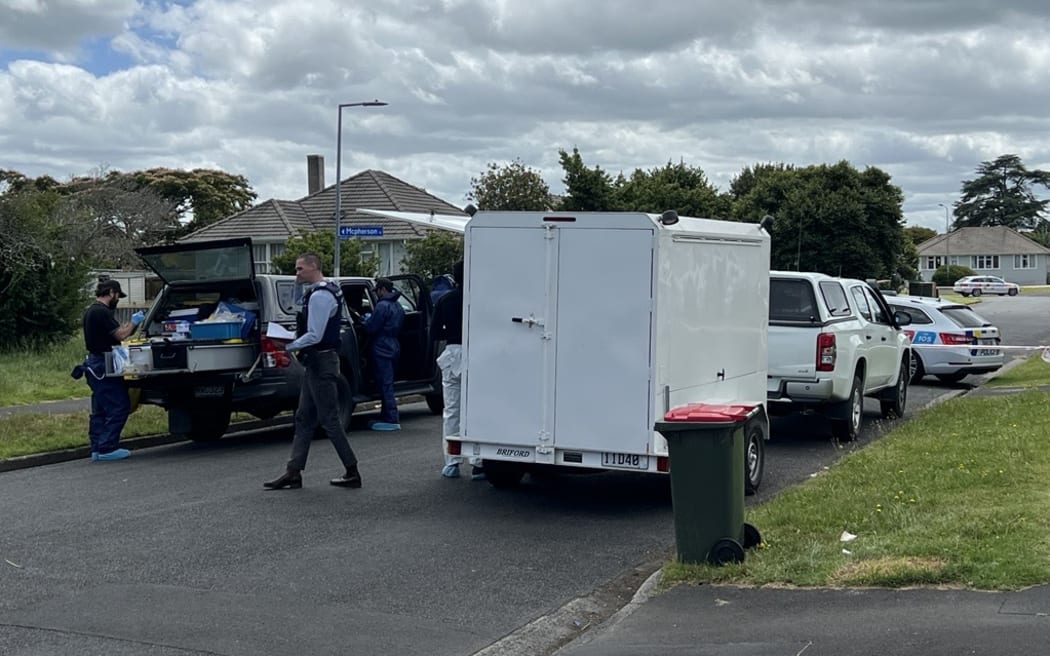 Police on Douglas Crescent outside the address where a stabbing incident took place.
