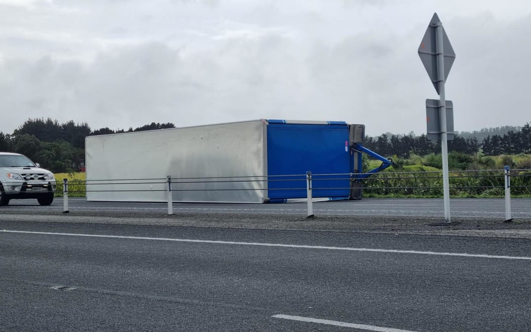Truck trailer blown on its side SH3 between New Plymouth and Bell Block, near Henwood Road on ramp.
