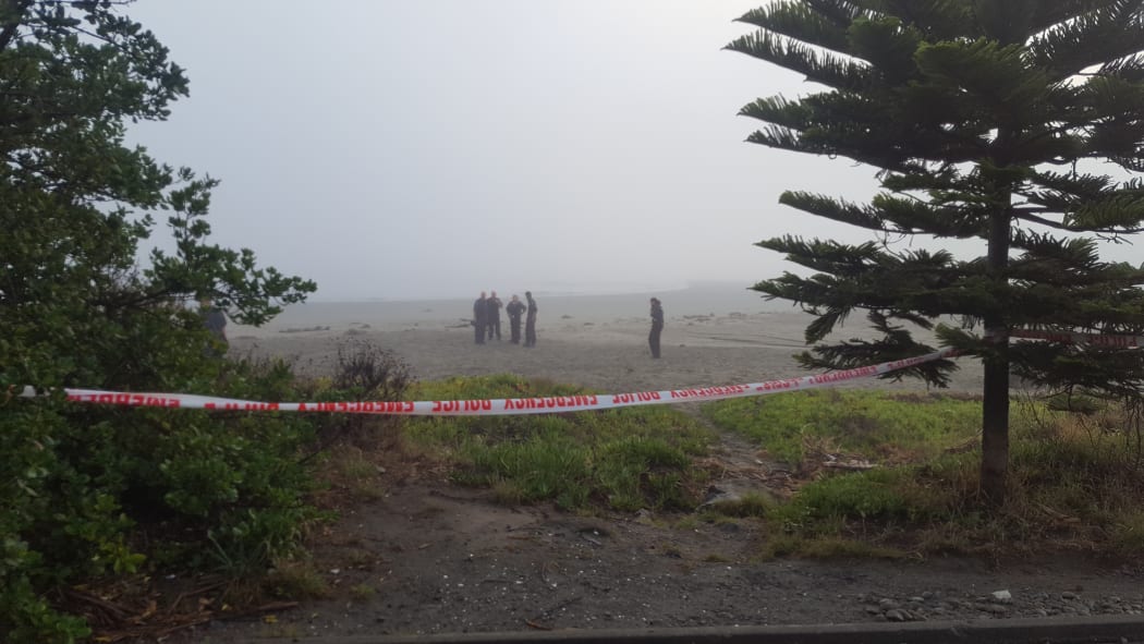 Police at the cordon in Sumner where a body, thought to be that of 14-year-old Jack Sutton, was found on the beach this morning.