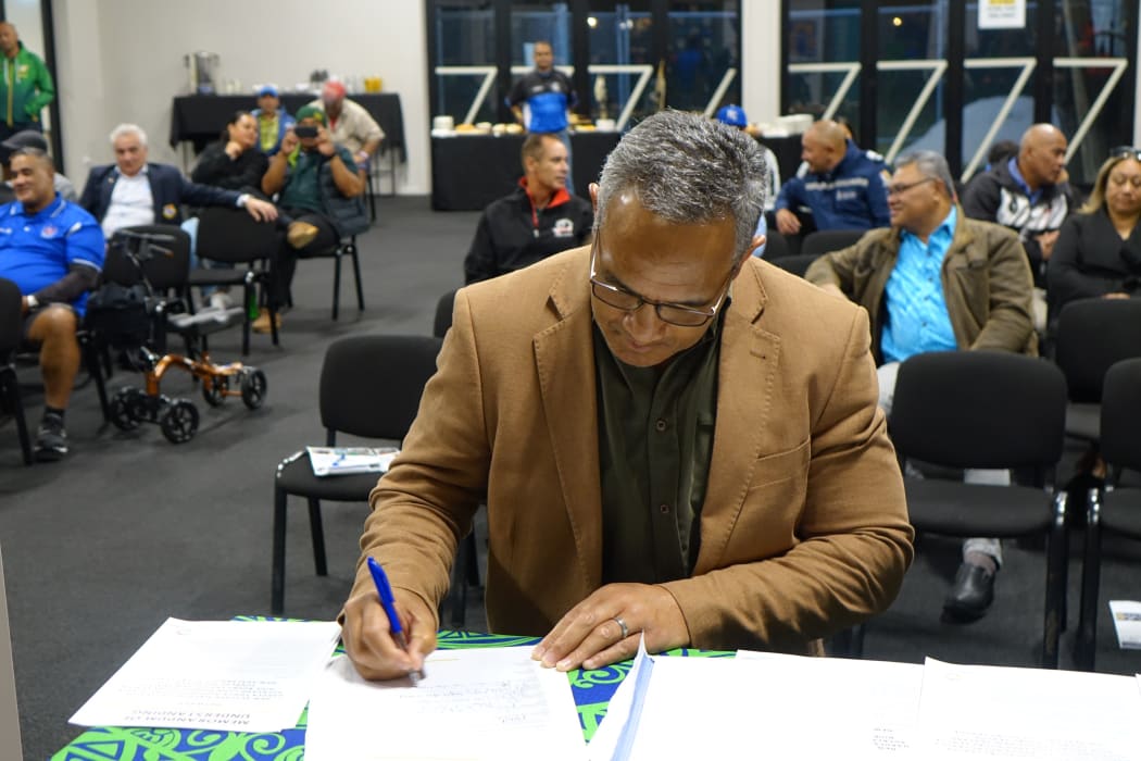 Duane Mann signing the Pasifika Aotearoa Collective MOU on behalf of Hakula Tonga Aotearoa Rugby League Inc.