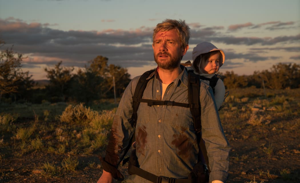 Martin Freeman and one of the two sets of twins who plays his daughter Rosie in Cargo.