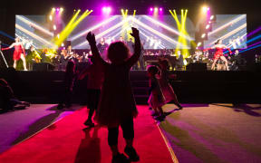 Children dancing at Orchestra Wellington's Symphony in the Hutt concert 2022
