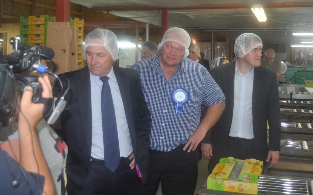 PM John Key and Mark Osborne visiting a Kerikeri kiwifruit packhouse on the final day of campaigning in the Northland by-election.