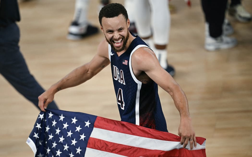 US guard Steph Curry celebrates winning the men's gold medal following the Olympic basketball final against France.