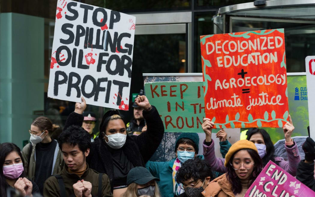 LONDON, UNITED KINGDOM - OCTOBER 29: Youth climate activists protest outside the Standard Chartered HQ against financing of fossil fuel projects during Defund Climate Chaos global day of action
