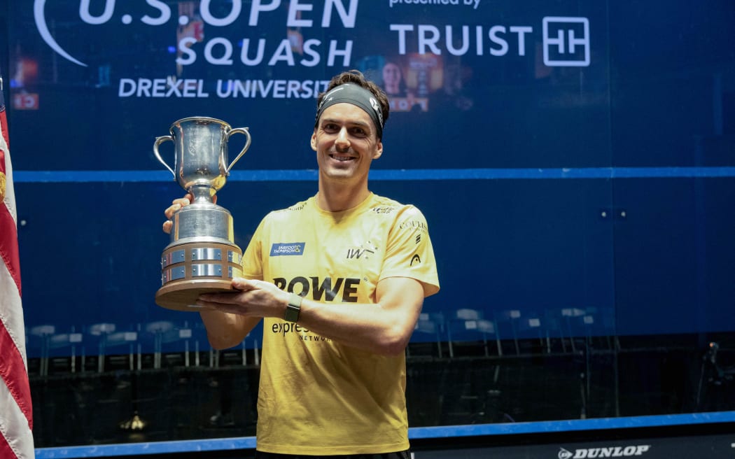 Paul Coll poses with the trophy.