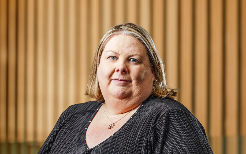 A head-and-shoulders professional photo of Nicolette Dickson