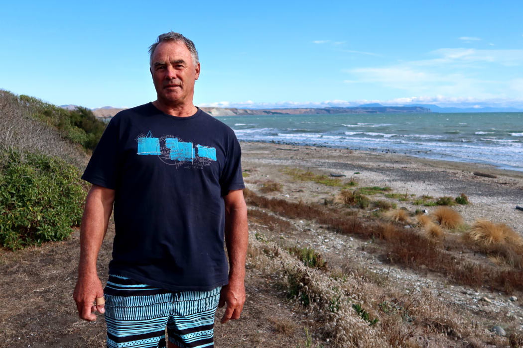 Craig Marfell has built several log barricades to keep motorists from damaging areas above the high tide line