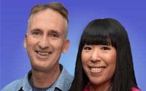 Mark and Perlina stand together smiling