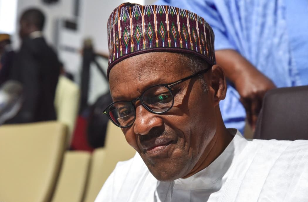 Nigerian president Muhammadu Buhari looks on during the African Union summit at the palais des Congres in Niamey, on July 7, 2019.