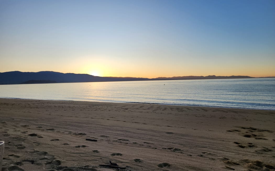 Late summer sun setting over Farewell Spit, Golden Bay