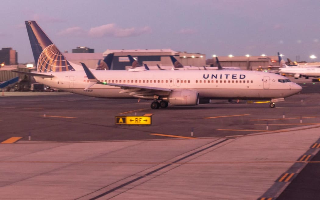 United Airlines Boeing 737-800 with registration N78511 and 2x CFMI jet engines seen taxiing.  General view of United Airlines airplanes during the sunset magic hour at Newark Liberty International Airport EWR / KEWR in Newark and Elizabeth, New Jersey, USA as seen on November 12, 2019.  United UA UAL is the 3rd largest airline in the world, member of Star Alliance aviation alliance with headquarters at Willis Tower in Chicago and multiple hubs across the United States with Newark one of the majors. (Photo by Nicolas Economou/NurPhoto) (Photo by Nicolas Economou / NurPhoto / NurPhoto via AFP)