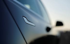 The door handle on a 2018 Tesla Model 3 electric vehicle. Problems with the door handle have reportedly trapped passengers in Tesla vehicles in some instances.