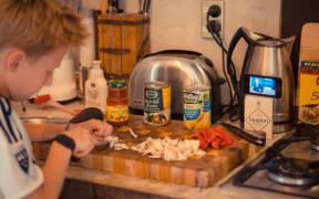 @CharlieLeComte is shown on Twitter with the hashtag #cookingwithjohn, making Chicken Tacos while watching @CheckpointRNZ @JohnJCampbell