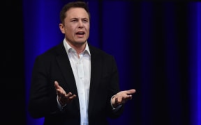Billionaire entrepreneur and founder of SpaceX Elon Musk speaks at the 68th International Astronautical Congress 2017 in Adelaide on September 29, 2017. 
Musk said his company SpaceX has begun serious work on the BFR Rocket as he plans an Interplanetary Transport System. / AFP PHOTO / PETER PARKS