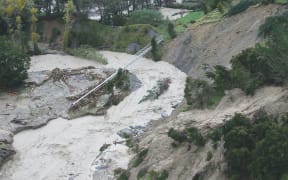 Urgent repair work is under way on the pipe that brings the city’s water supply from Waingake. Debris brought down in Cyclone Gabrielle can be seen under and around the pipe.