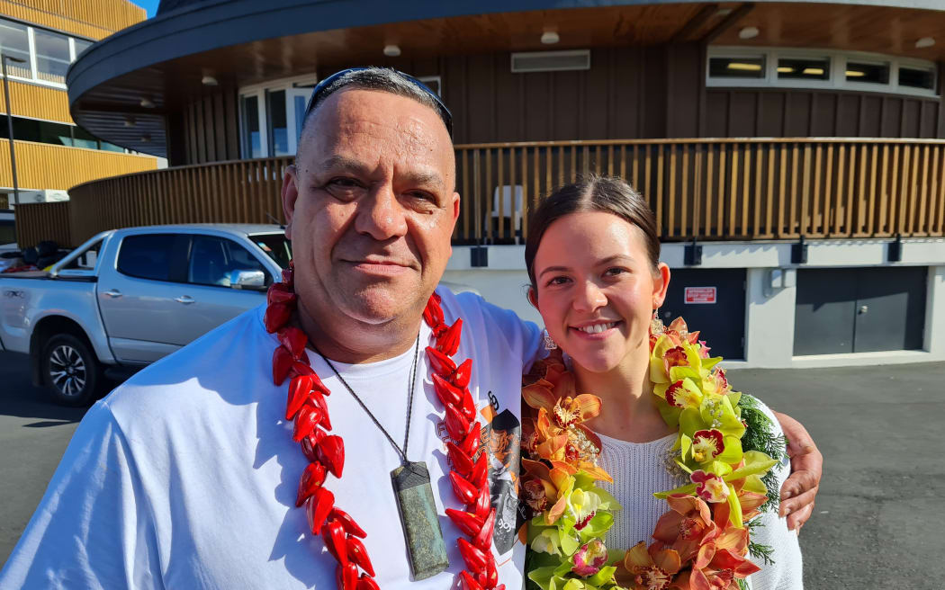David Crichton standing with his daughter.