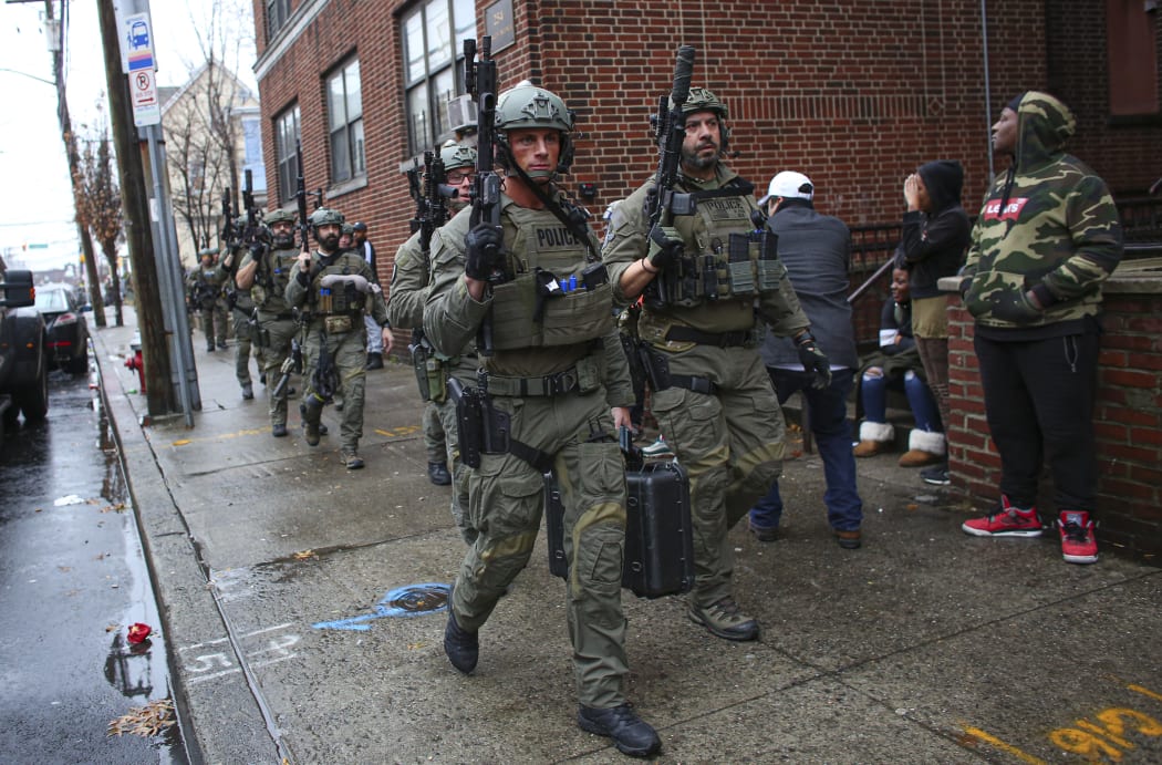 Police officers arriving at the scene of the shooting in Jersey City, New Jersey.