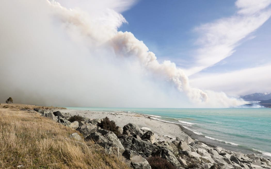 Smoke drifting across Lake Pukaki from the large blaze at Pukaki Downs.