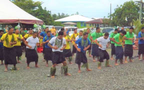 The returning workers entertain during their home coming.