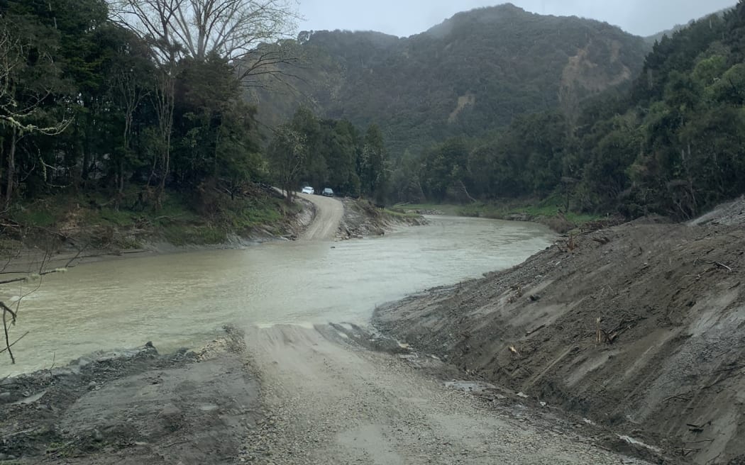 With their bridge having washed out in Cyclone Gabrielle, the Burgess family's only access to and from town is directly through the Hangaroa River via a low level crossing.