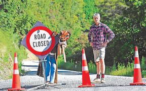 Wild Lab Tiaki Taiao programme lead Peter Jarratt with Stinky the stoat on Gisborne's Riverside Road, a large section of which is only accessible to residents following Cyclone Gabrielle.