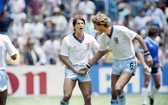 England's Gary Lineker (L) is congratulated by teammate Terry Butcher (R) after Lineker scored England's only goal in the World Cup quarterfinal soccer match between Argentina and England on June 22, 1986 in Mexico City.