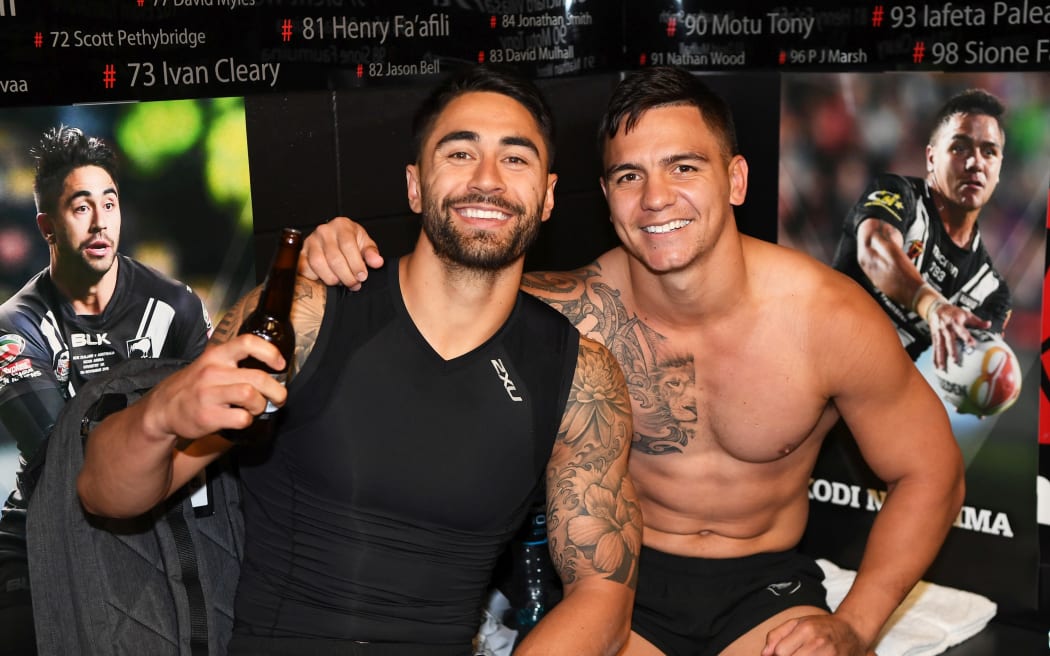 Shaun Johnson and Kodi Nikorima celebrate after the Kiwis win over the Kangaroos.