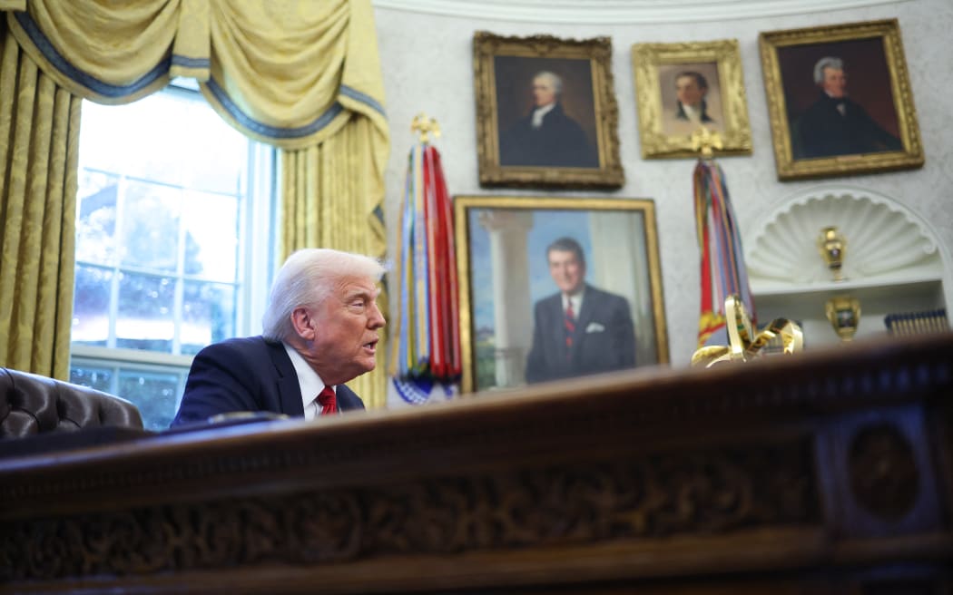 US President Donald Trump speaks to the press after signing an executive order in the Oval Office of the White House on March 26, 2025 in Washington, DC. President Trump announced 25% tariffs on all foreign-made cars.