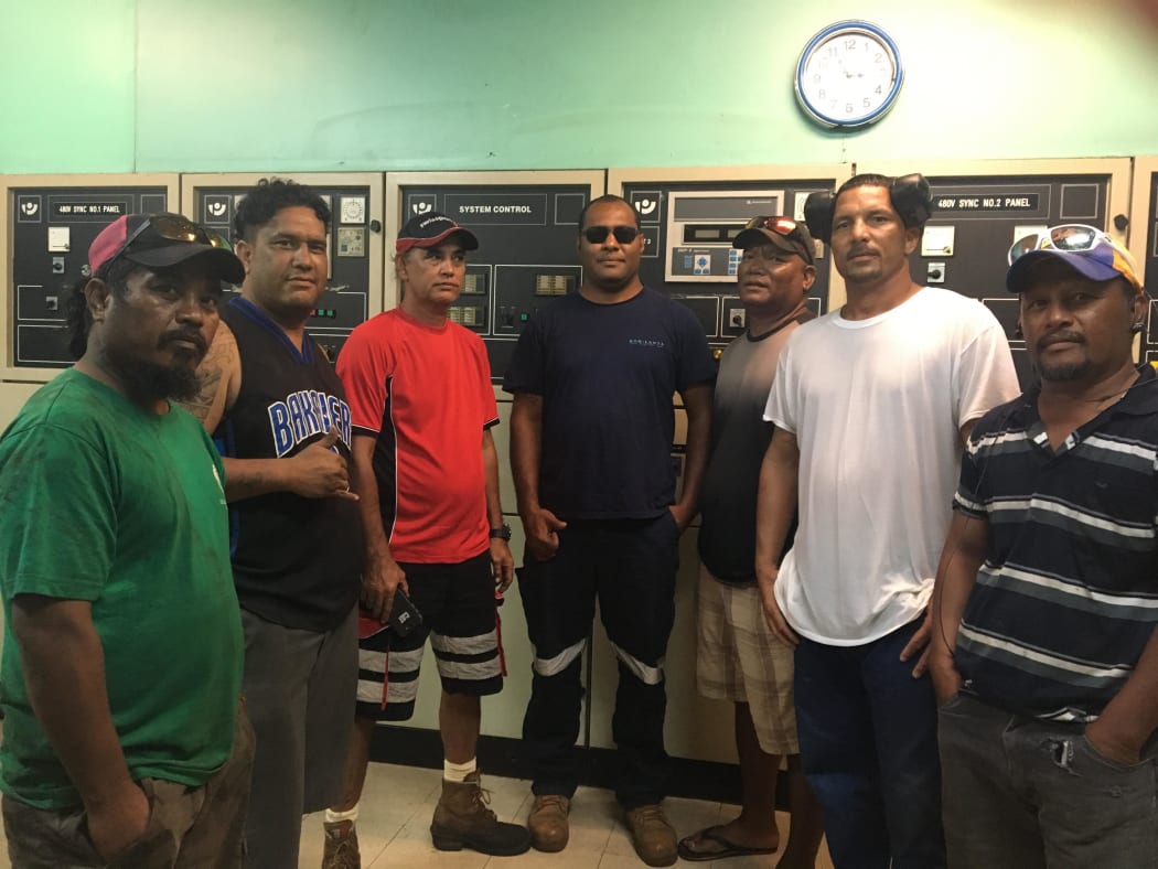 Aggreko engineer Jone Bola from Fiji, center, with Ebeye power plant staff when they installed rental generator units recently to stabilize Ebeye Island's power situation.